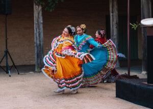 fiesta dancers in brightly colored dresses