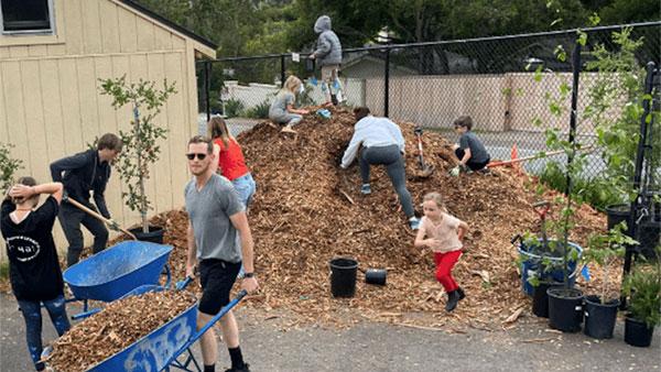 SBEF Fiscally Sponsored Campus Canopy photograph of people doing garden work at a local school