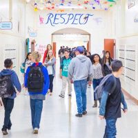 UNHOUSED-STUDENT-SUPPORT-FUND FISCALLY SPONSORED program UNHOUSED-STUDENT-SUPPORT-FUND students in a santa barbara school hallway