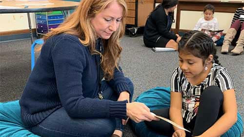 SBEF Signature Program - Readers are Leaders participants - adult and child reading together