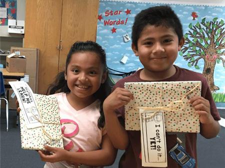 sp-teacher-grants kids holding up their artwork