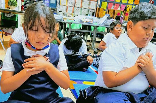 Kind Mind students meditating